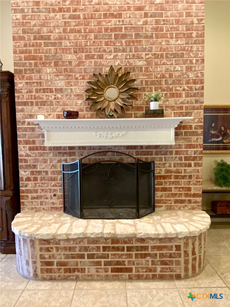 210 Ranchgate Trail McGregor, TX 76657 - Photo 8 of 33 Living room fireplace