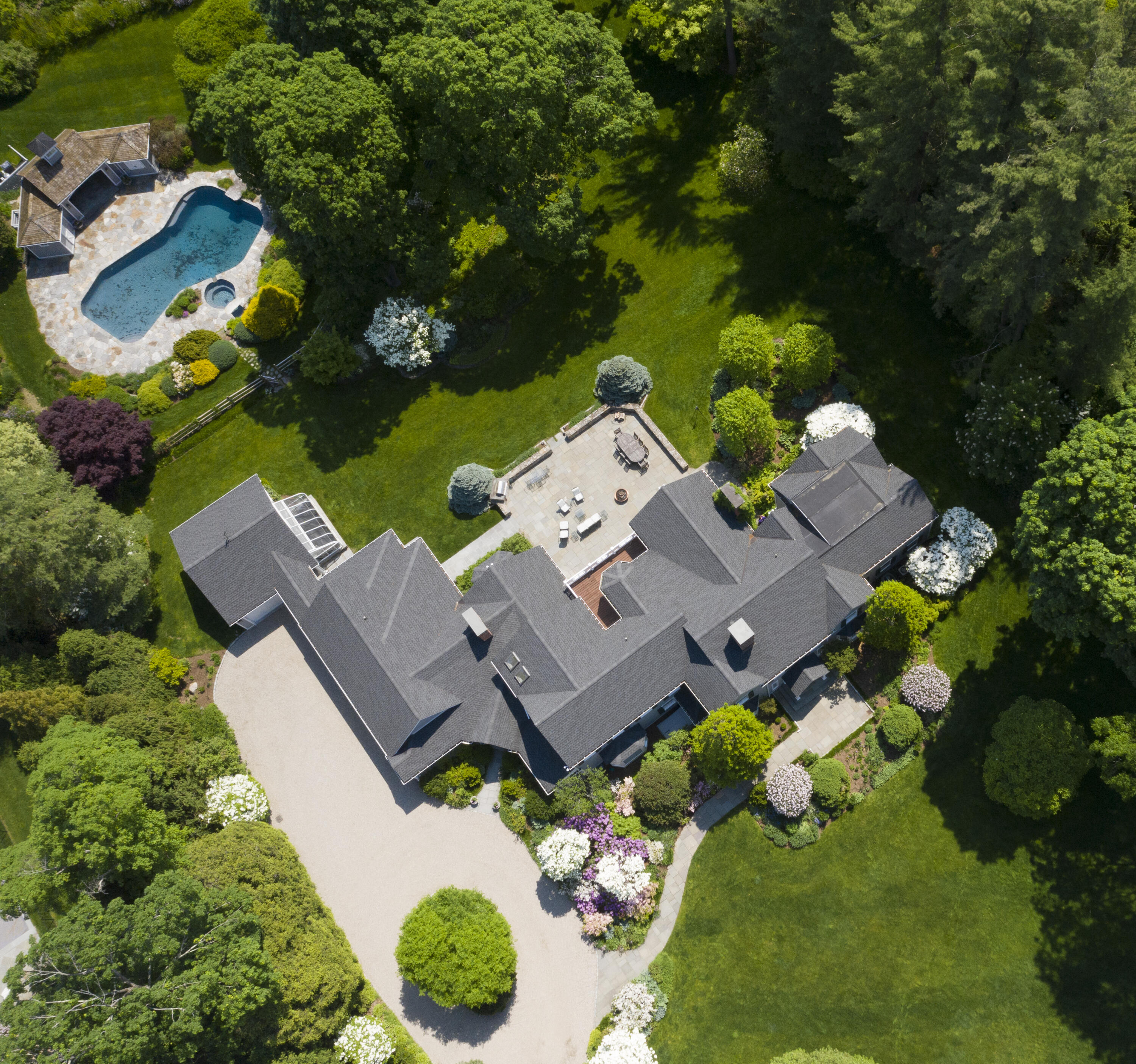 35 Rosebrook Road New Canaan, CT 06840 - Photo 2 of 38 an aerial view of a house with yard swimming pool and outdoor seating
