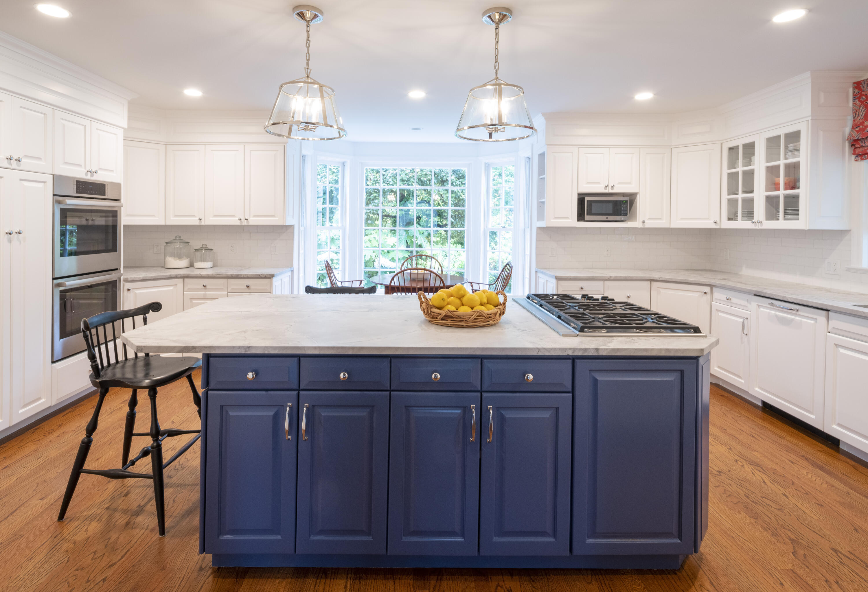 35 Rosebrook Road New Canaan, CT 06840 - Photo 11 of 38 a kitchen with a sink a center island and cabinets
