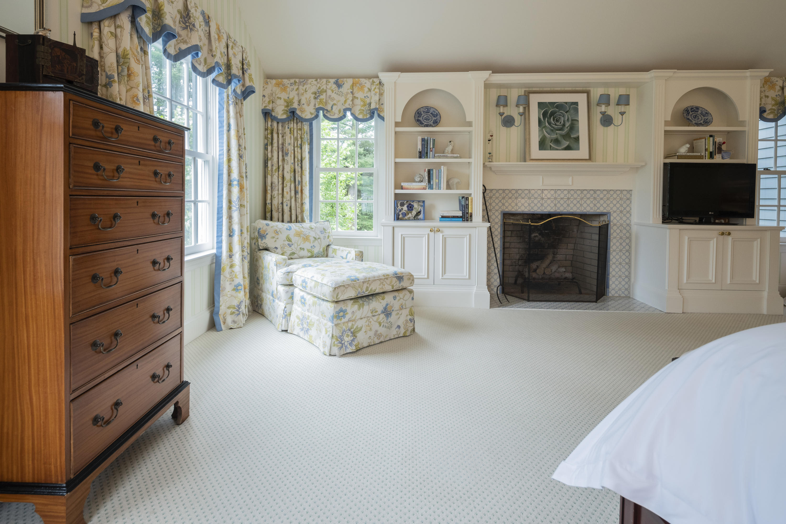 35 Rosebrook Road New Canaan, CT 06840 - Photo 24 of 38 a living room with furniture a flat screen tv and a fireplace