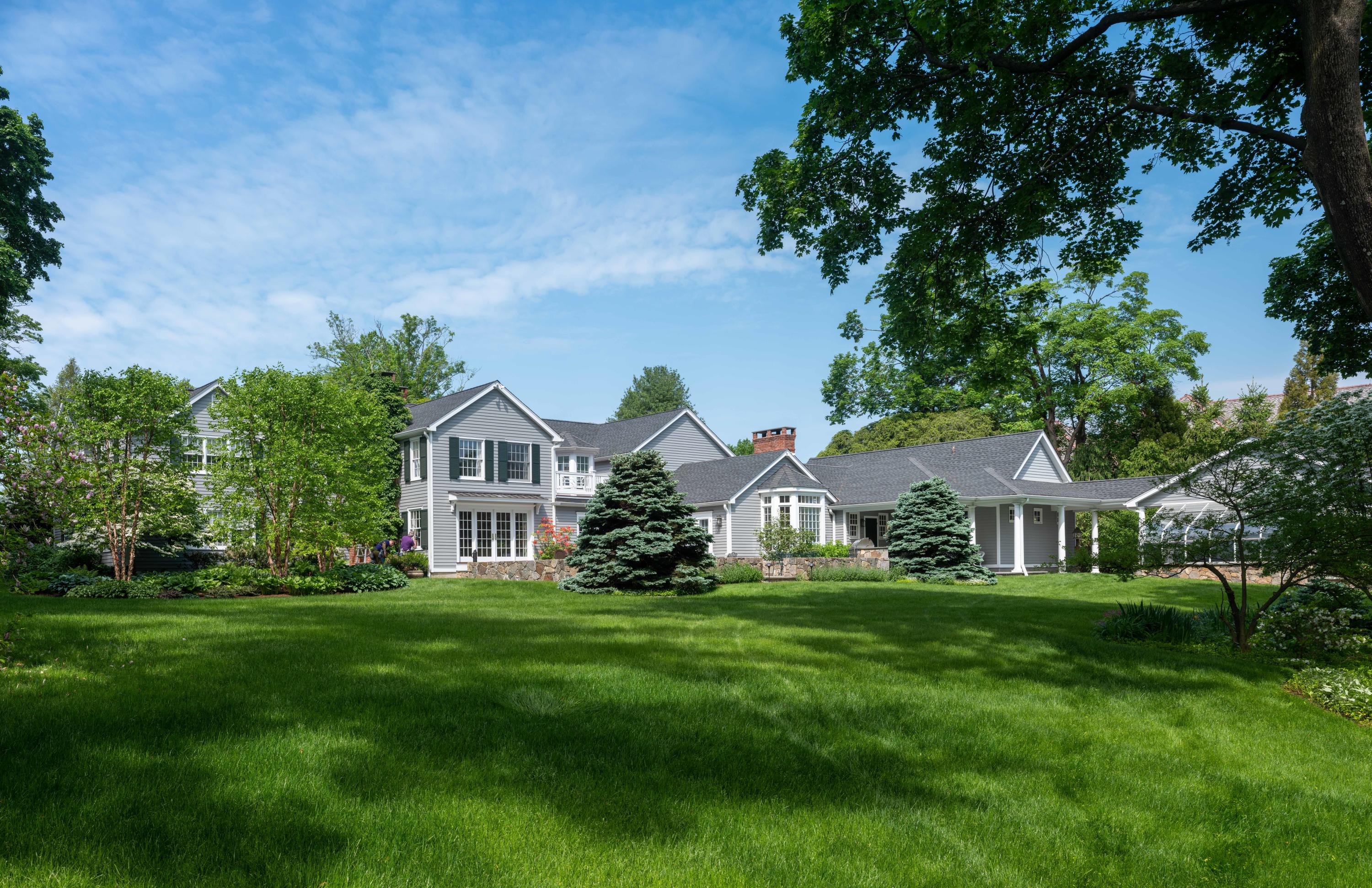 35 Rosebrook Road New Canaan, CT 06840 - Photo 4 of 38 a front view of a house with a garden