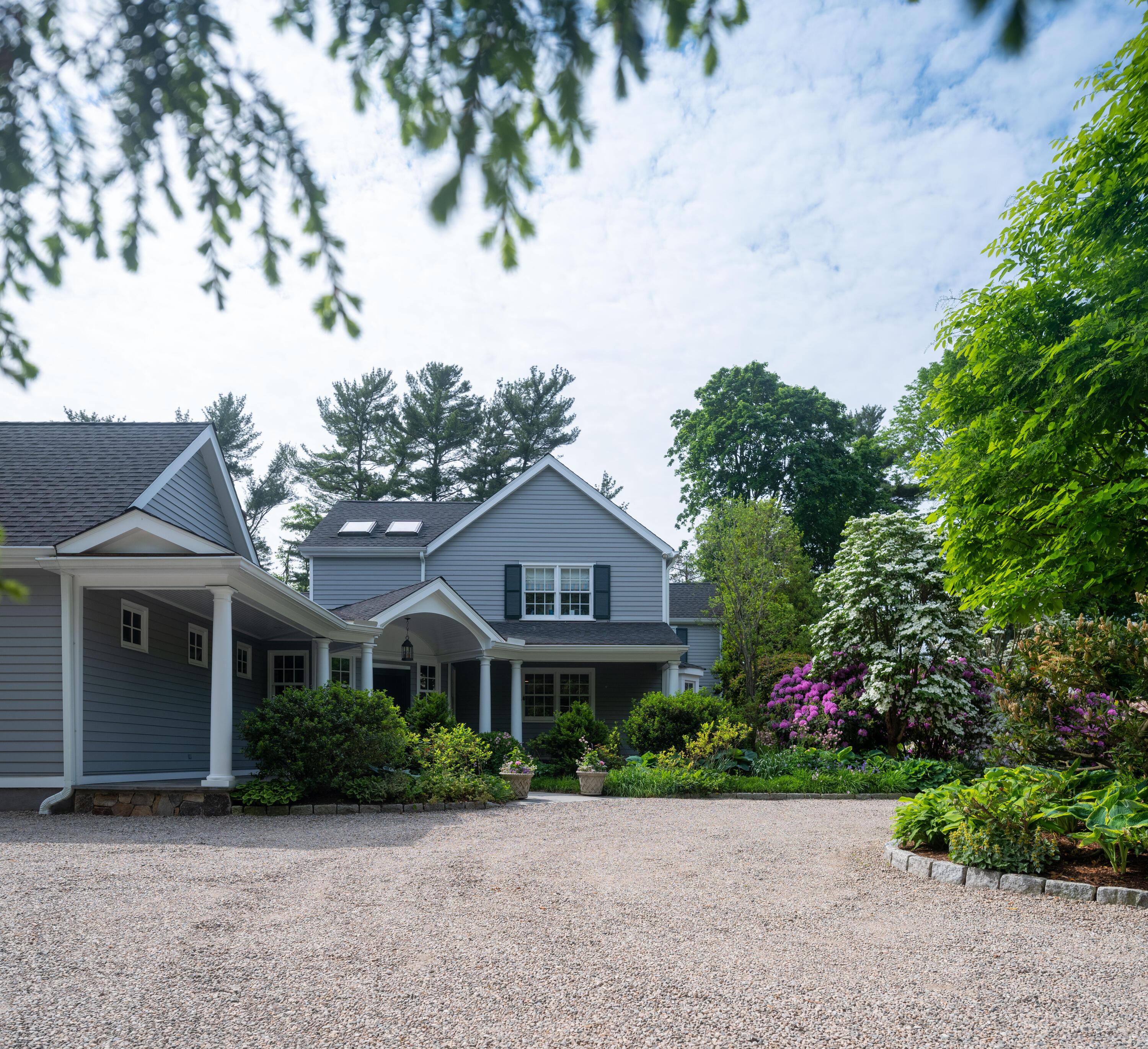 35 Rosebrook Road New Canaan, CT 06840 - Photo 38 of 38 a front view of a house with garden