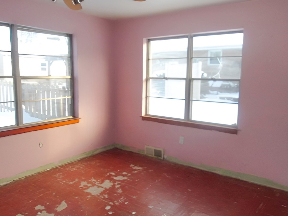 108 North Locust Street Maroa, IL 61756 - Photo 11 of 13 an empty room with a window
