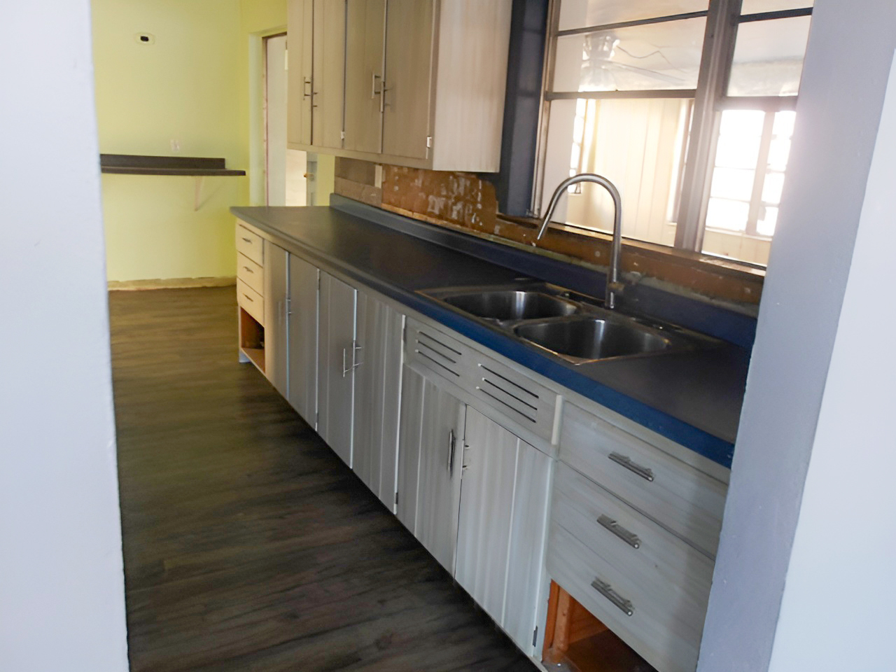 108 North Locust Street Maroa, IL 61756 - Photo 4 of 13 a kitchen with granite countertop white cabinets and sink