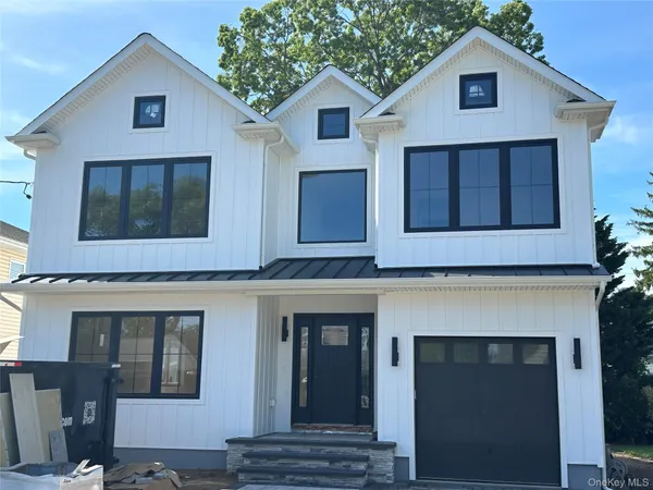 a front view of a house with yard