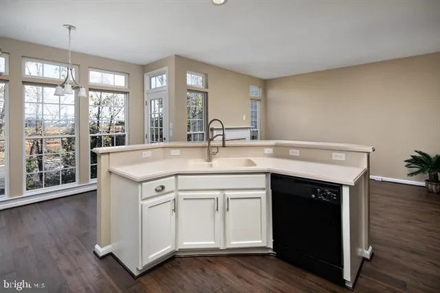 a kitchen with a sink and cabinets