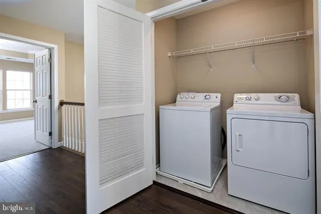 a view of storage and utility room with washer and dryer