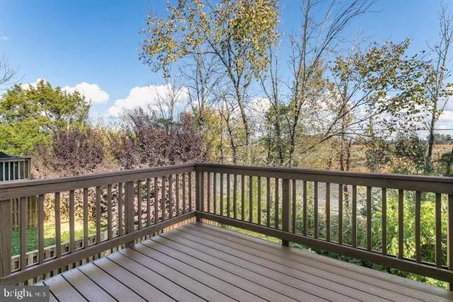 a view of balcony with wooden floor