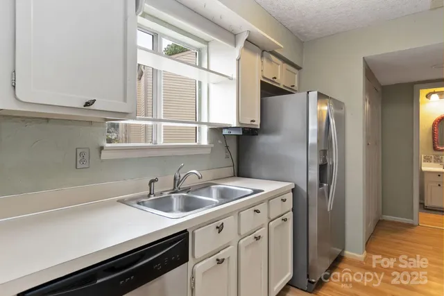 a kitchen with a stove and a microwave