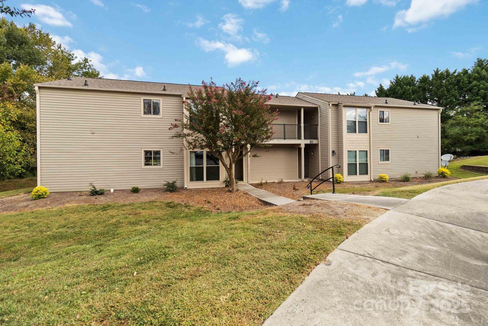 11001 Running Ridge Rd. Charlotte, NC 28226 - Photo 2 of 38 a view of a house with backyard and sitting area