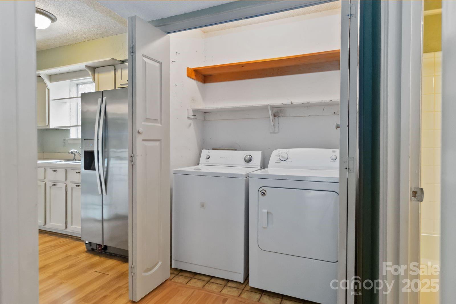 11001 Running Ridge Rd. Charlotte, NC 28226 - Photo 22 of 38 a utility room with dryer and washer