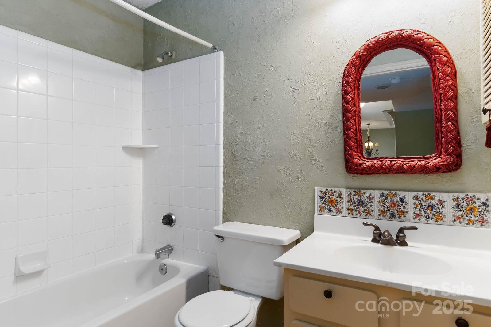 11001 Running Ridge Rd. Charlotte, NC 28226 - Photo 23 of 38 a bathroom with a sink and a mirror