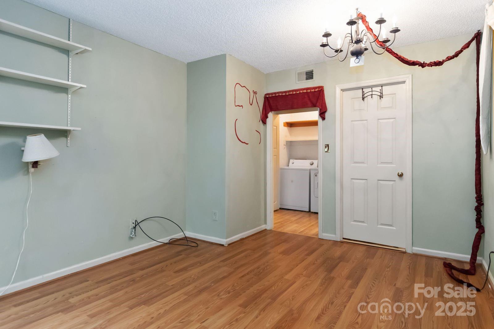 11001 Running Ridge Rd. Charlotte, NC 28226 - Photo 25 of 38 a view of a livingroom with wooden floor