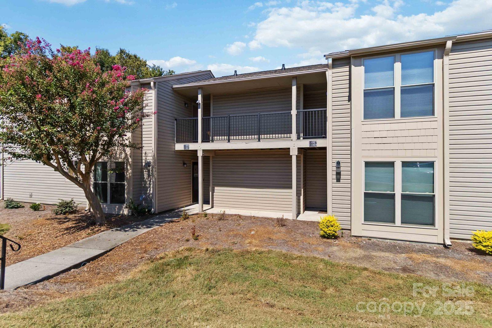 11001 Running Ridge Rd. Charlotte, NC 28226 - Photo 4 of 38 a view of yellow house with a outdoor space