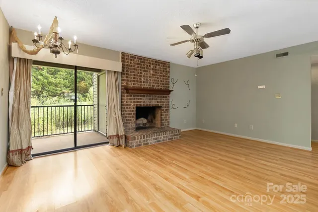 a bedroom with a bed and a fireplace