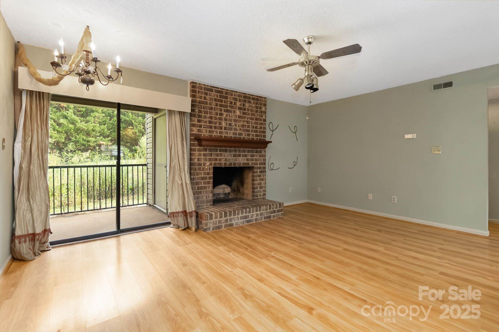 11001 Running Ridge Rd. Charlotte, NC 28226 - Photo 8 of 38 a view of an empty room with a balcony