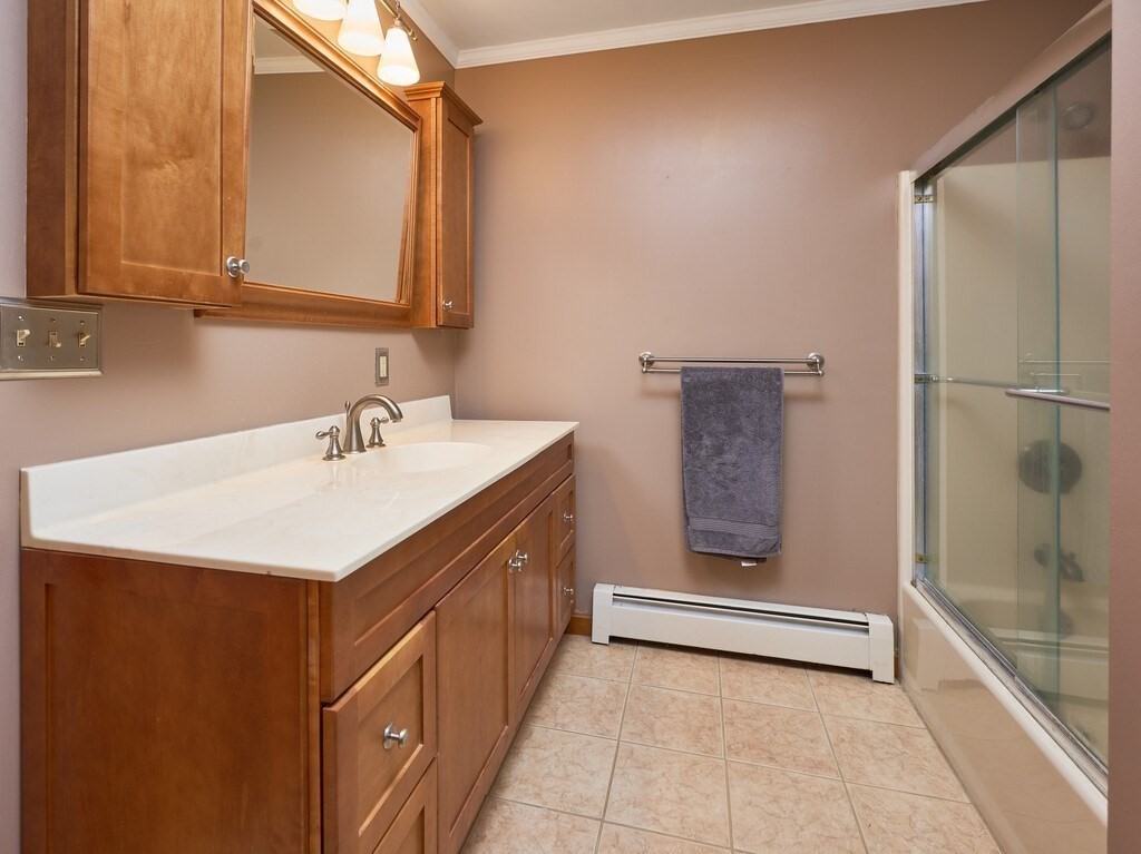 21 Collette Road Sturbridge, MA 01518 - Photo 21 of 42 a bathroom with a sink a mirror and a shower