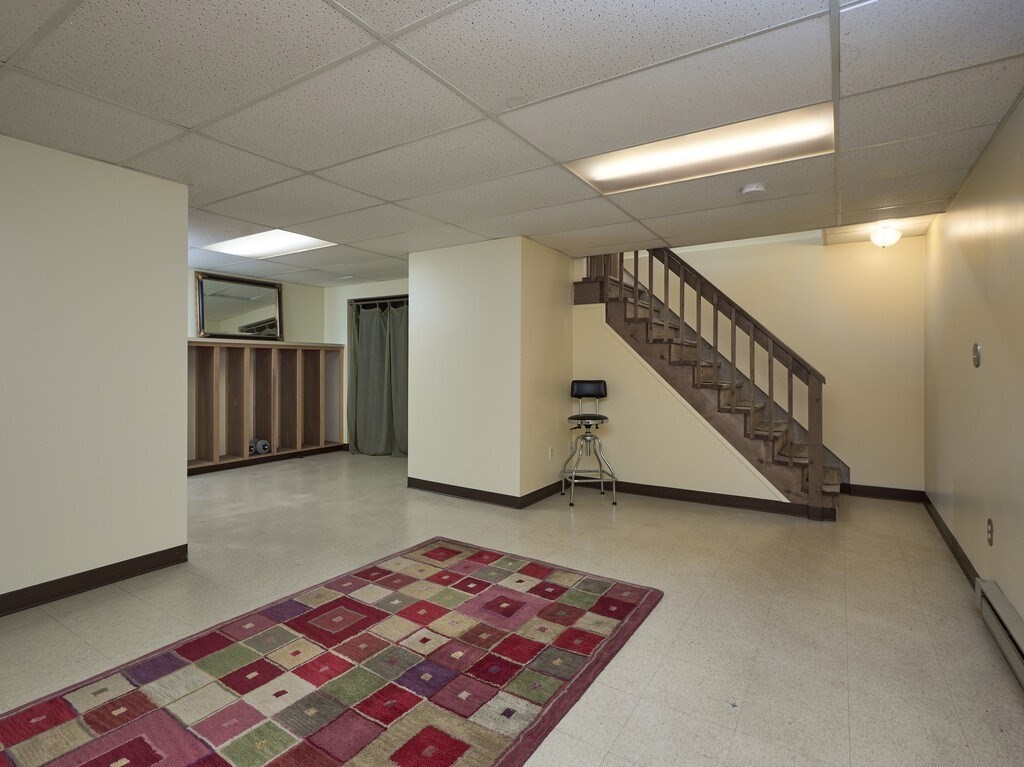 21 Collette Road Sturbridge, MA 01518 - Photo 24 of 42 a view of hallway with stairs and wooden floor