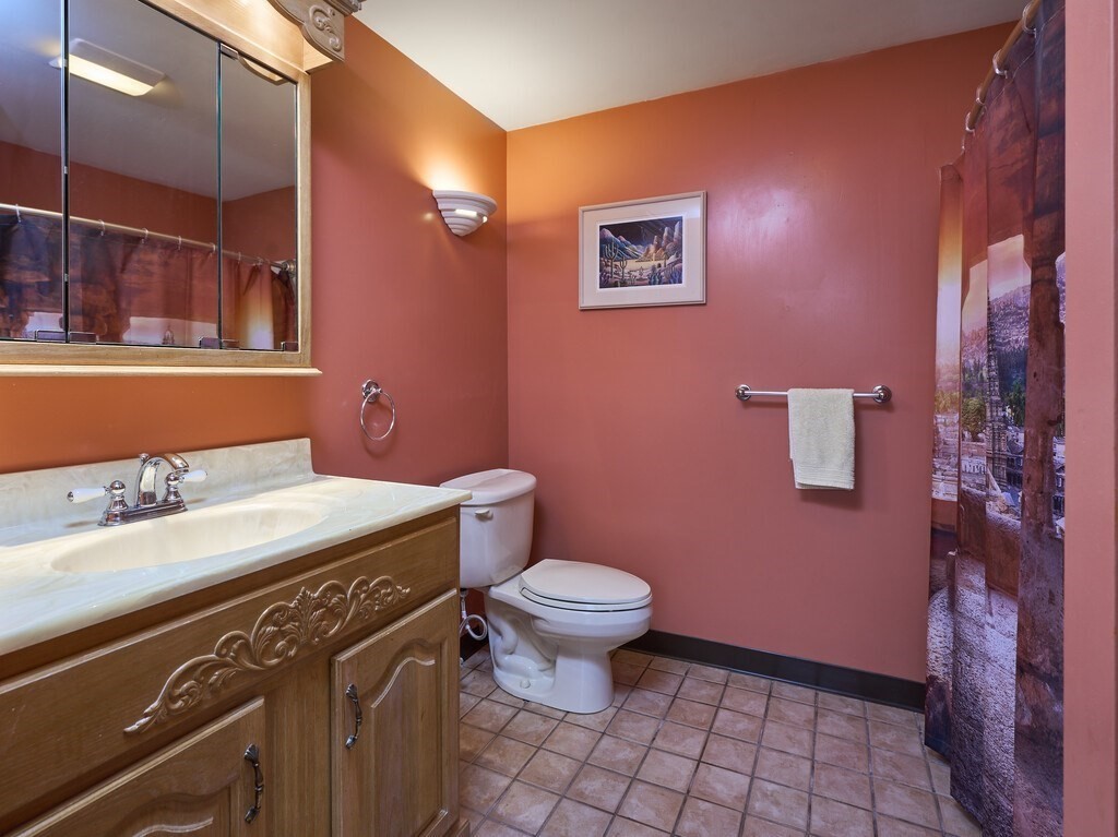 21 Collette Road Sturbridge, MA 01518 - Photo 29 of 42 a bathroom with a sink a toilet and a mirror