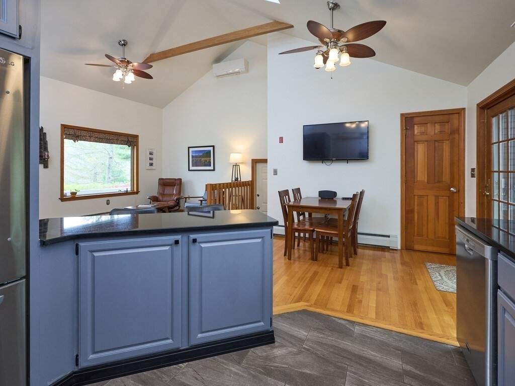 21 Collette Road Sturbridge, MA 01518 - Photo 10 of 42 a living room with furniture a flat screen tv and a window
