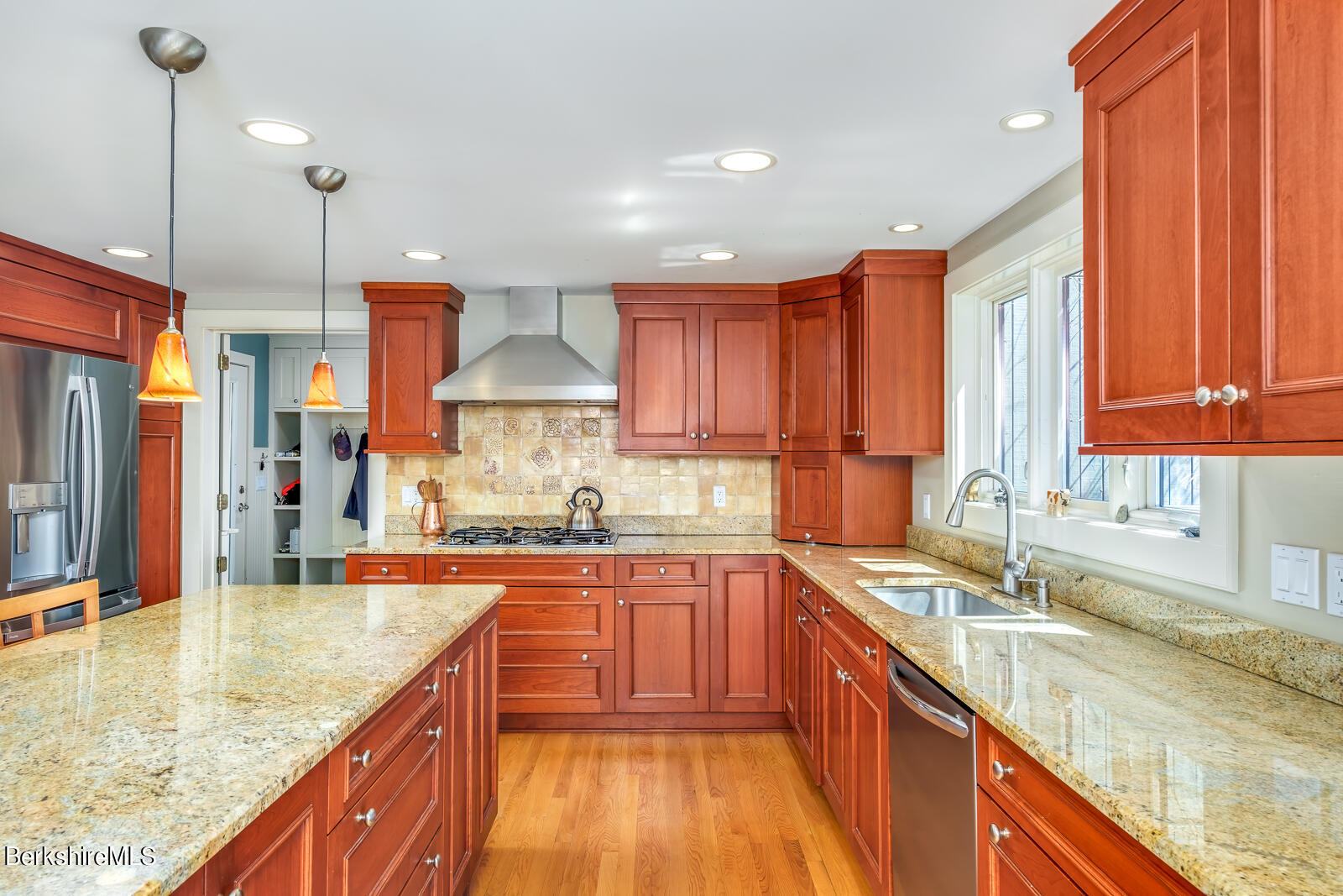 491 Henderson Road Williamstown, MA 01267 - Photo 11 of 42 a kitchen with stainless steel appliances granite countertop sink stove and refrigerator