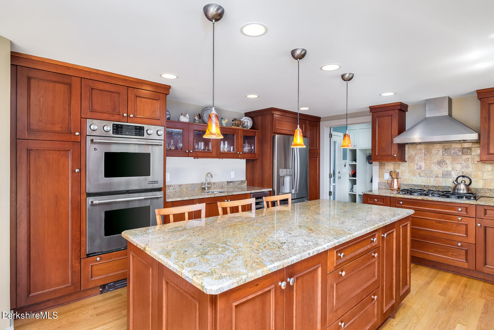 491 Henderson Road Williamstown, MA 01267 - Photo 12 of 42 a kitchen with stainless steel appliances granite countertop a stove a sink and a refrigerator