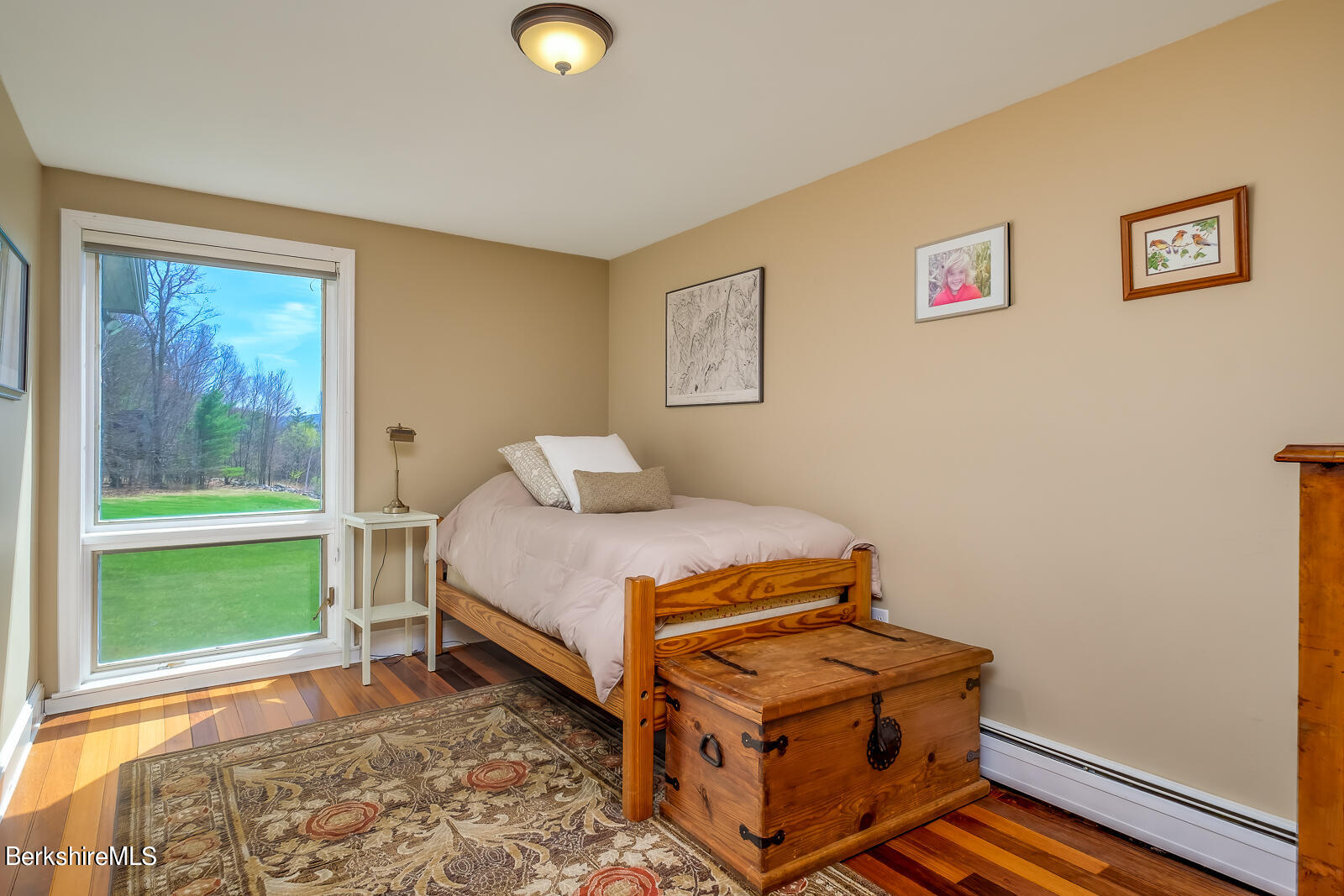 491 Henderson Road Williamstown, MA 01267 - Photo 20 of 42 a bedroom with a bed and a window