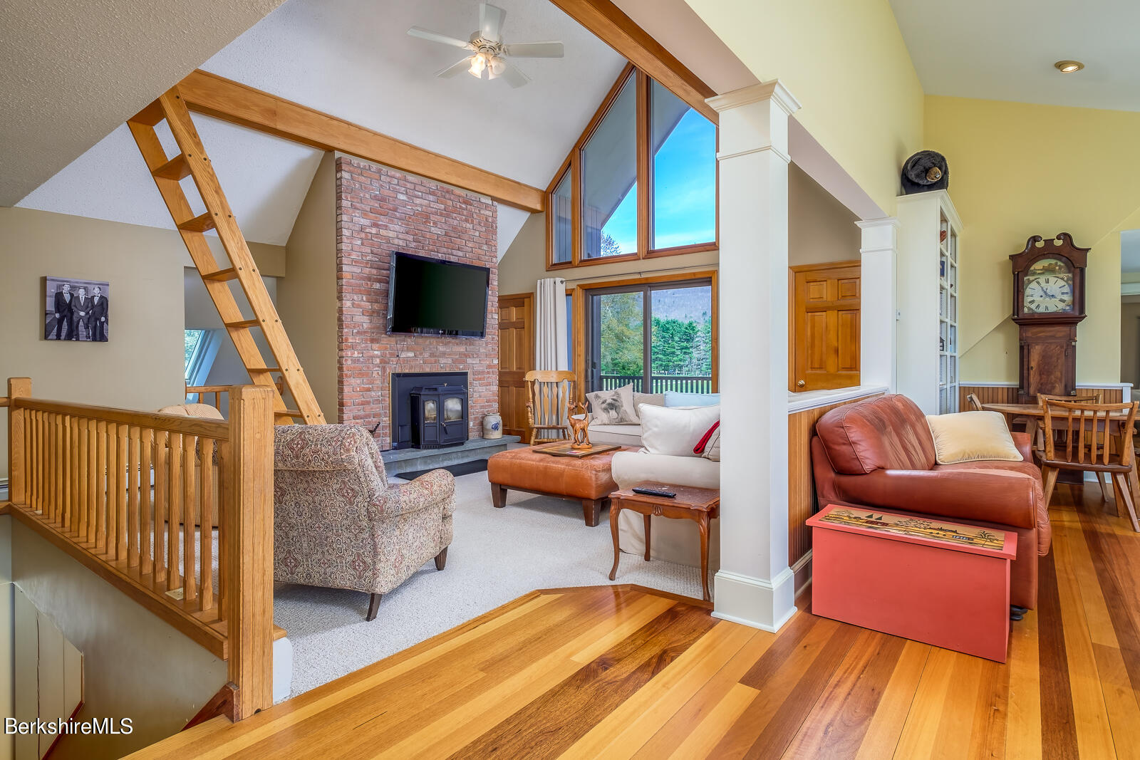 491 Henderson Road Williamstown, MA 01267 - Photo 22 of 42 a living room with furniture fireplace and a flat screen tv