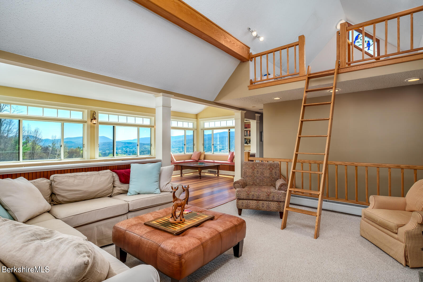 491 Henderson Road Williamstown, MA 01267 - Photo 24 of 42 a living room with furniture and a large window