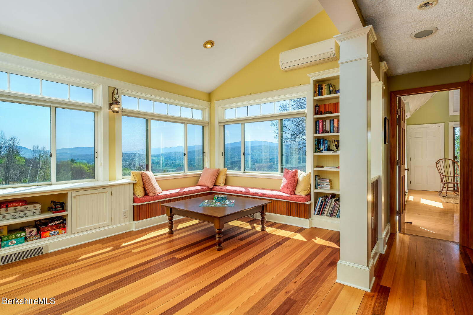 491 Henderson Road Williamstown, MA 01267 - Photo 25 of 42 a living room with furniture a rug and a floor to ceiling window