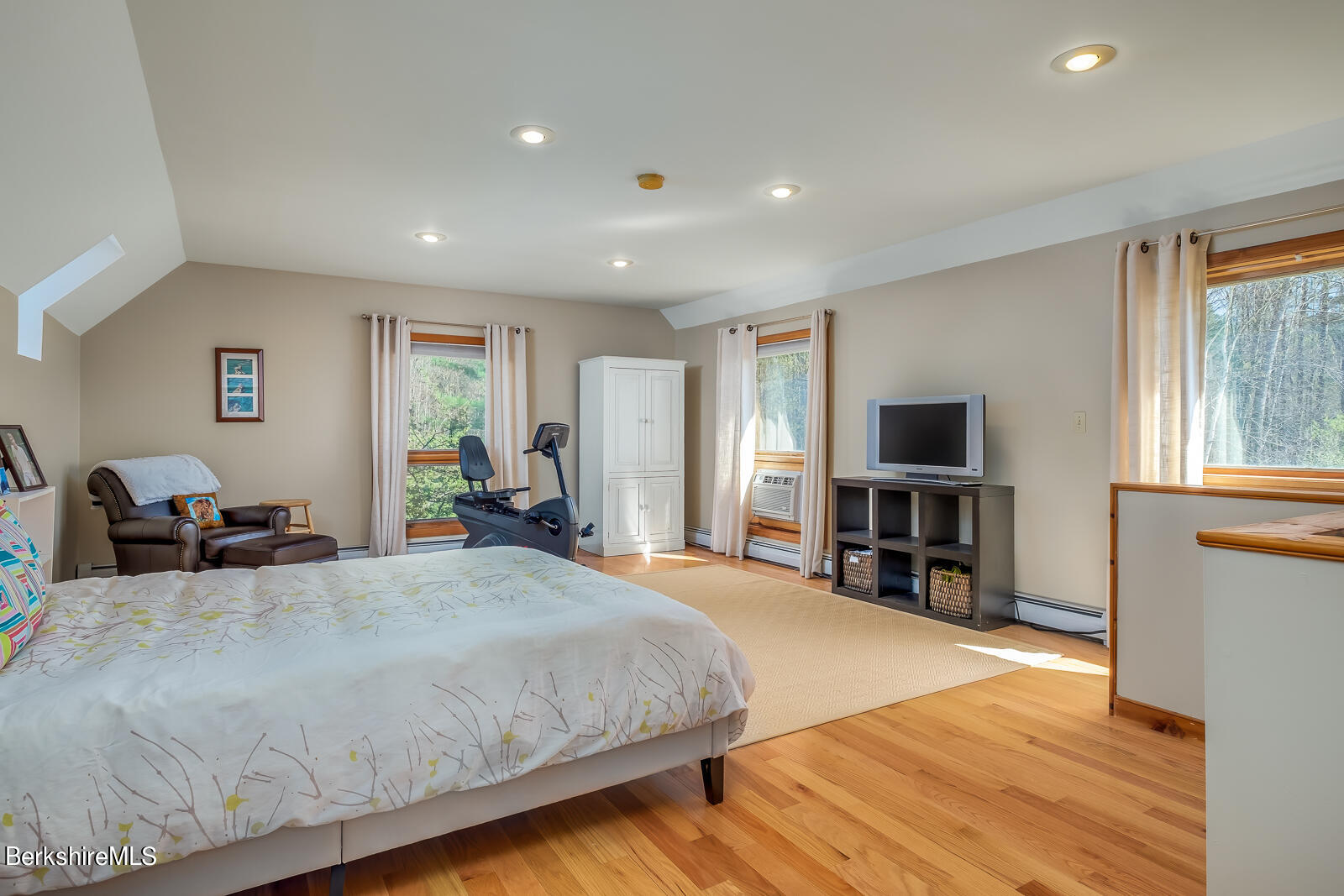 491 Henderson Road Williamstown, MA 01267 - Photo 29 of 42 a bedroom with a bed and a flat tv screen on the dresser