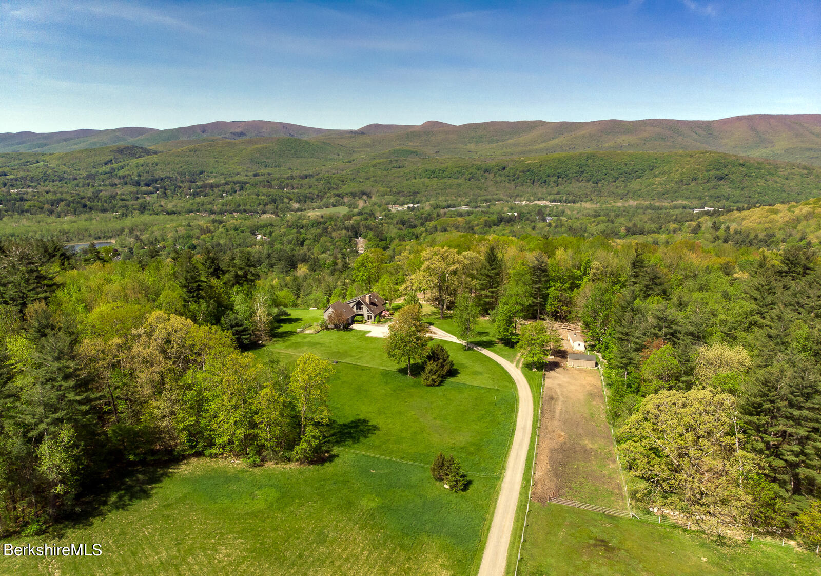 491 Henderson Road Williamstown, MA 01267 - Photo 4 of 42 a view of a lake with a mountain