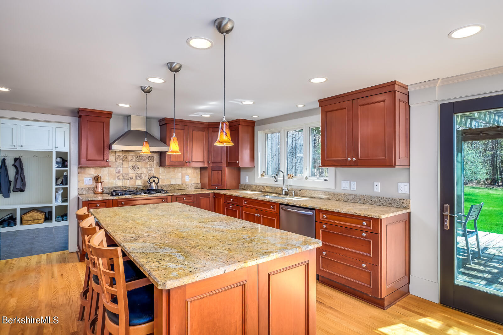 491 Henderson Road Williamstown, MA 01267 - Photo 10 of 42 a kitchen with granite countertop kitchen island stainless steel appliances a sink stove and a center island