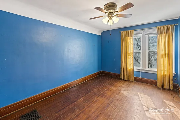 a view of room with window and ceiling fan