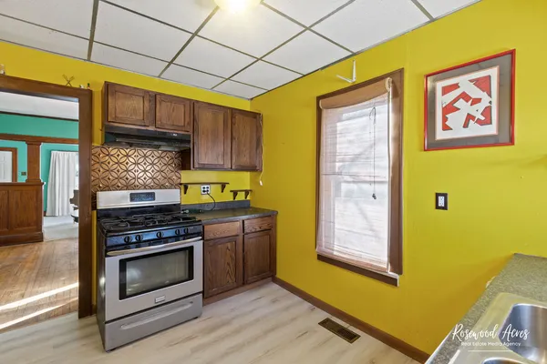 a kitchen with stainless steel appliances granite countertop a stove and a refrigerator