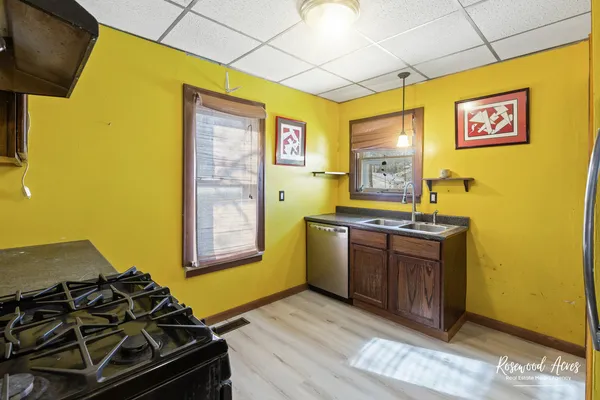a kitchen with stainless steel appliances granite countertop a stove and a refrigerator