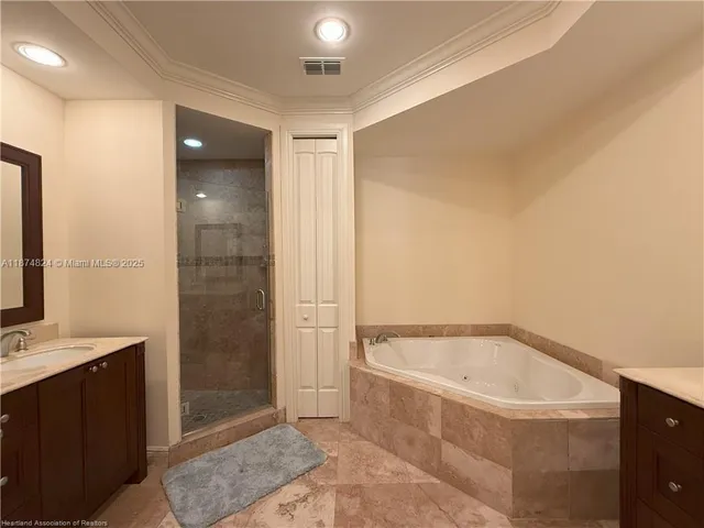 a bathroom with a bathtub and shower