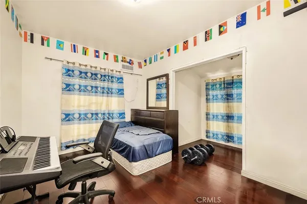 a bedroom with furniture and a book shelf