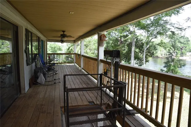 a view of balcony with couch and wooden floor