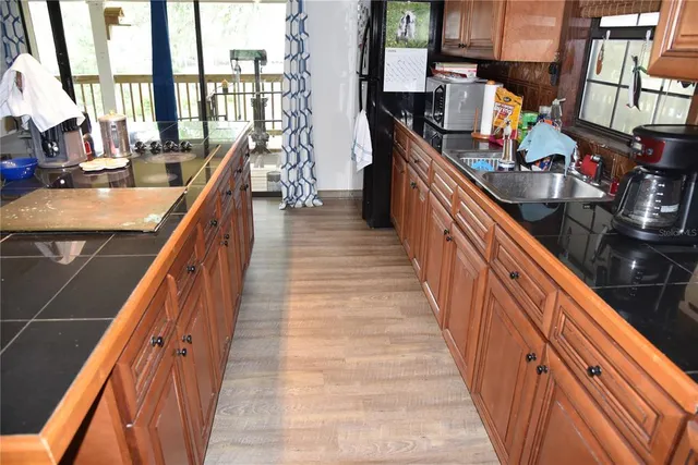 a bedroom with a bed lamps and a large mirror