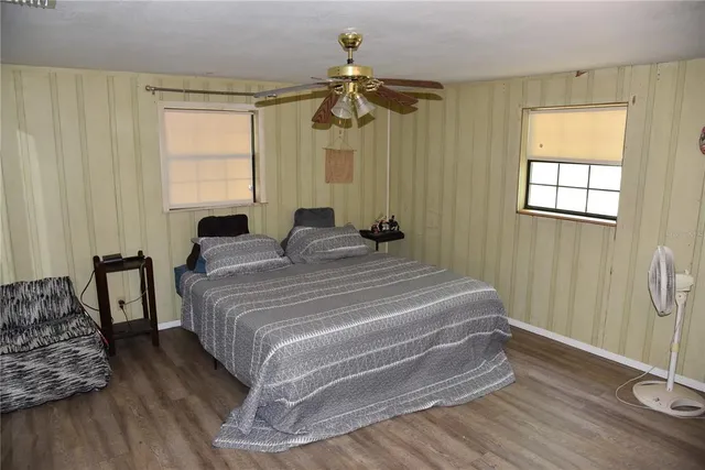 a living room with furniture gym equipment and a window