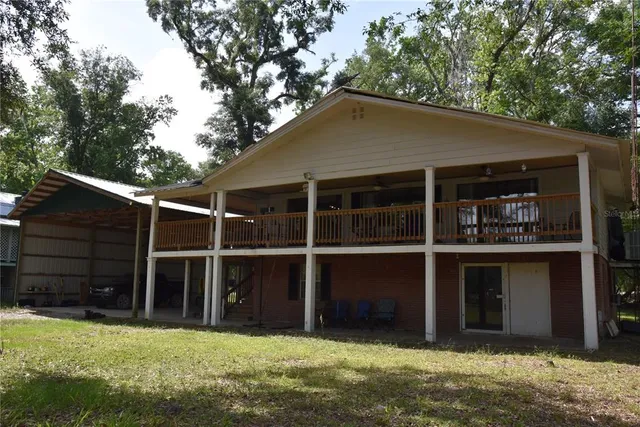 a house with trees in the background