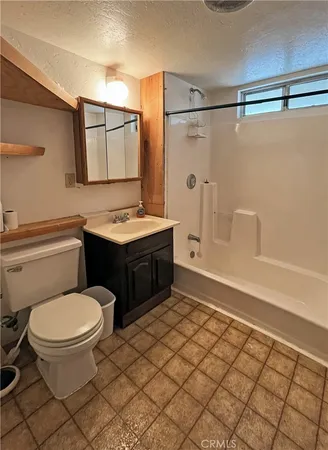 a view of an empty room with glass door