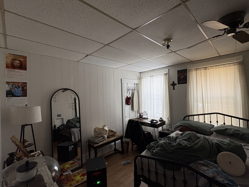 137 Centre Street, Unit 2 Boston, MA 02119 - Photo 3 of 8 a living room with furniture