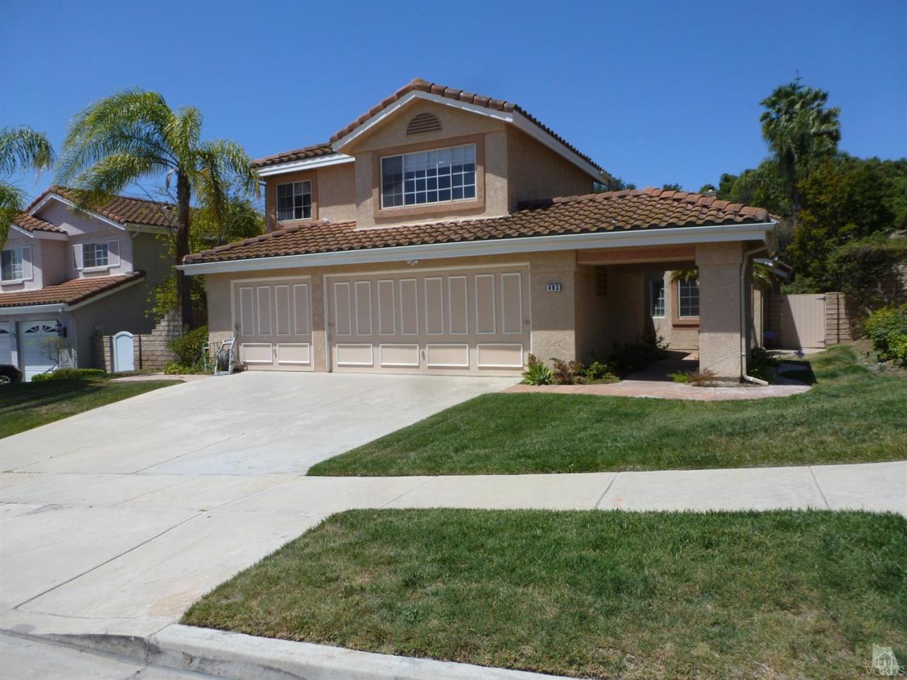 493 Innwood Road Simi Valley, CA 93065 - Photo 1 of 34 a view of a white house with a small yard and a fountain