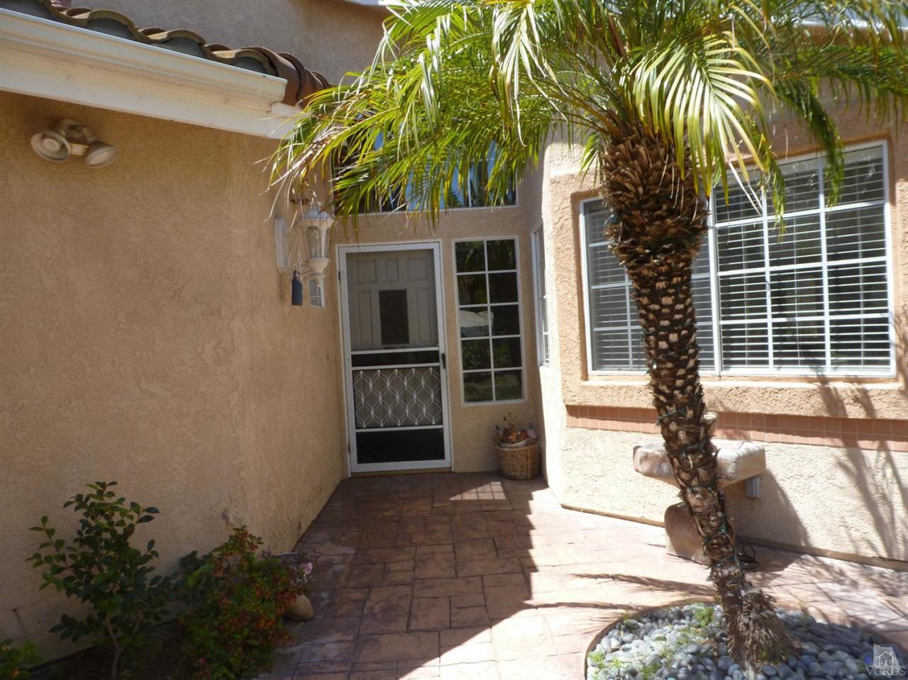 493 Innwood Road Simi Valley, CA 93065 - Photo 2 of 34 a front view of a house with a yard