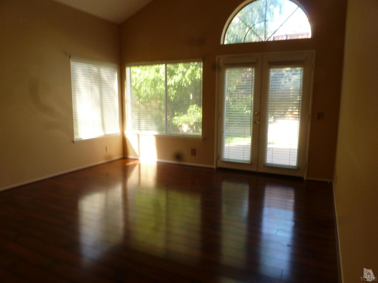 493 Innwood Road Simi Valley, CA 93065 - Photo 26 of 34 a view of an empty room with wooden floor and a window