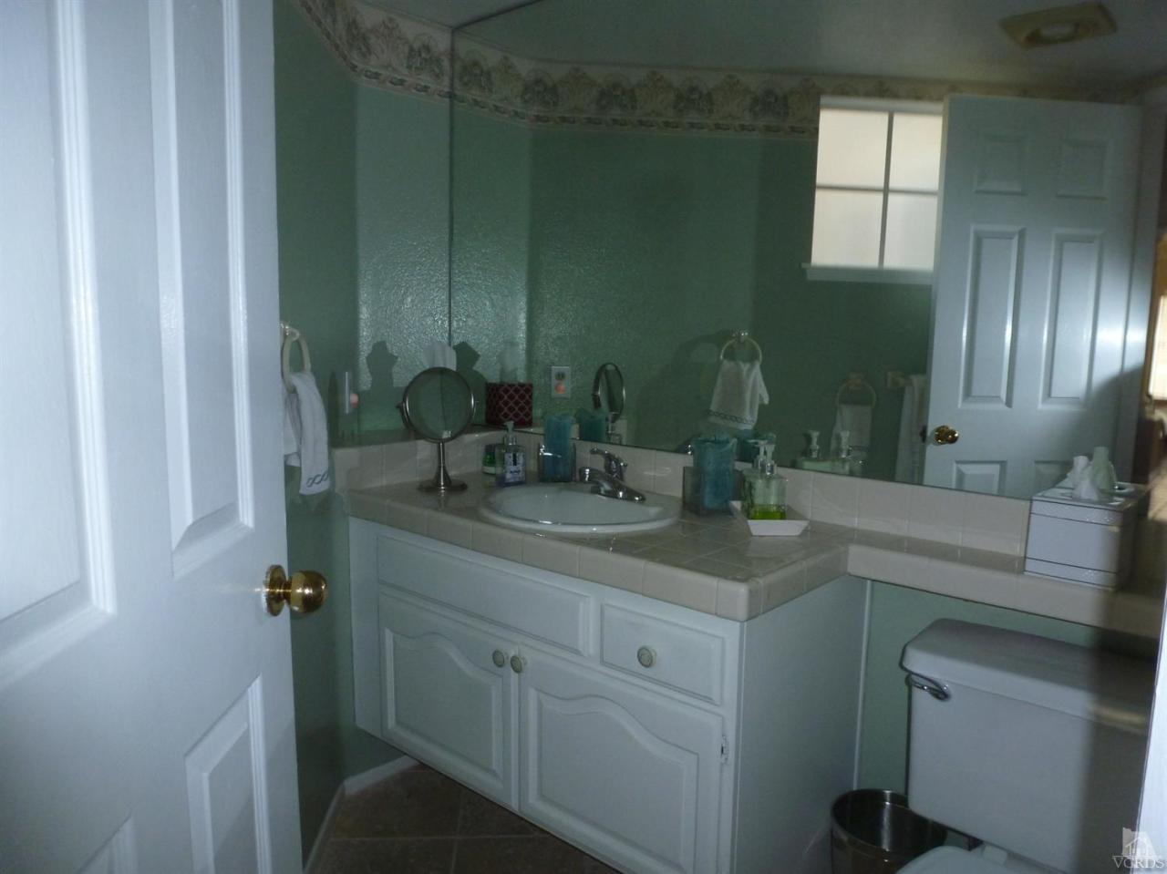 493 Innwood Road Simi Valley, CA 93065 - Photo 5 of 34 a bathroom with a sink and mirror
