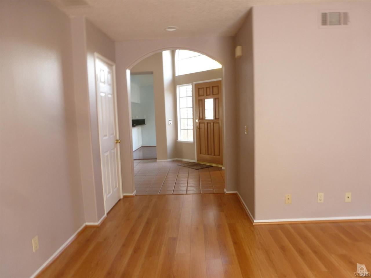 493 Innwood Road Simi Valley, CA 93065 - Photo 6 of 34 a view of a room with wooden floor and a window