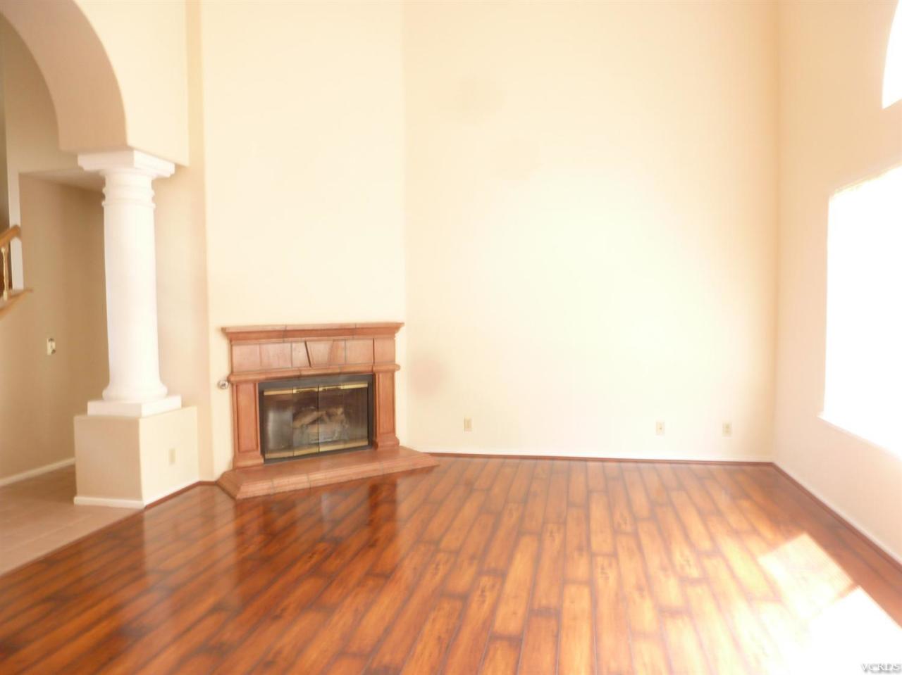 493 Innwood Road Simi Valley, CA 93065 - Photo 10 of 34 a view of empty room with wooden floor and fireplace